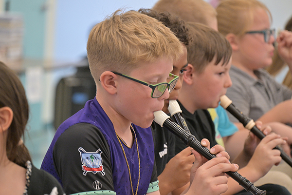 Students play recorders