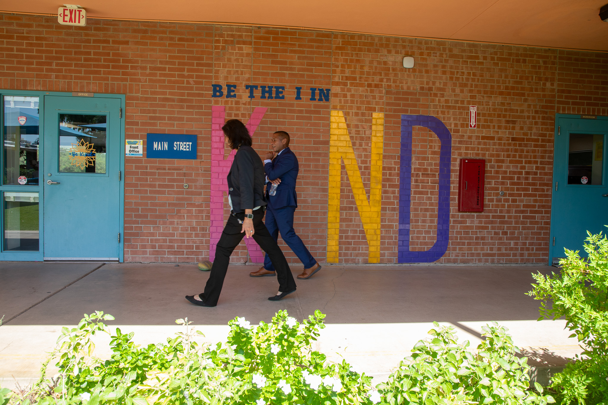 Dr. Trujillo and Kellond's principal walk around outside the school